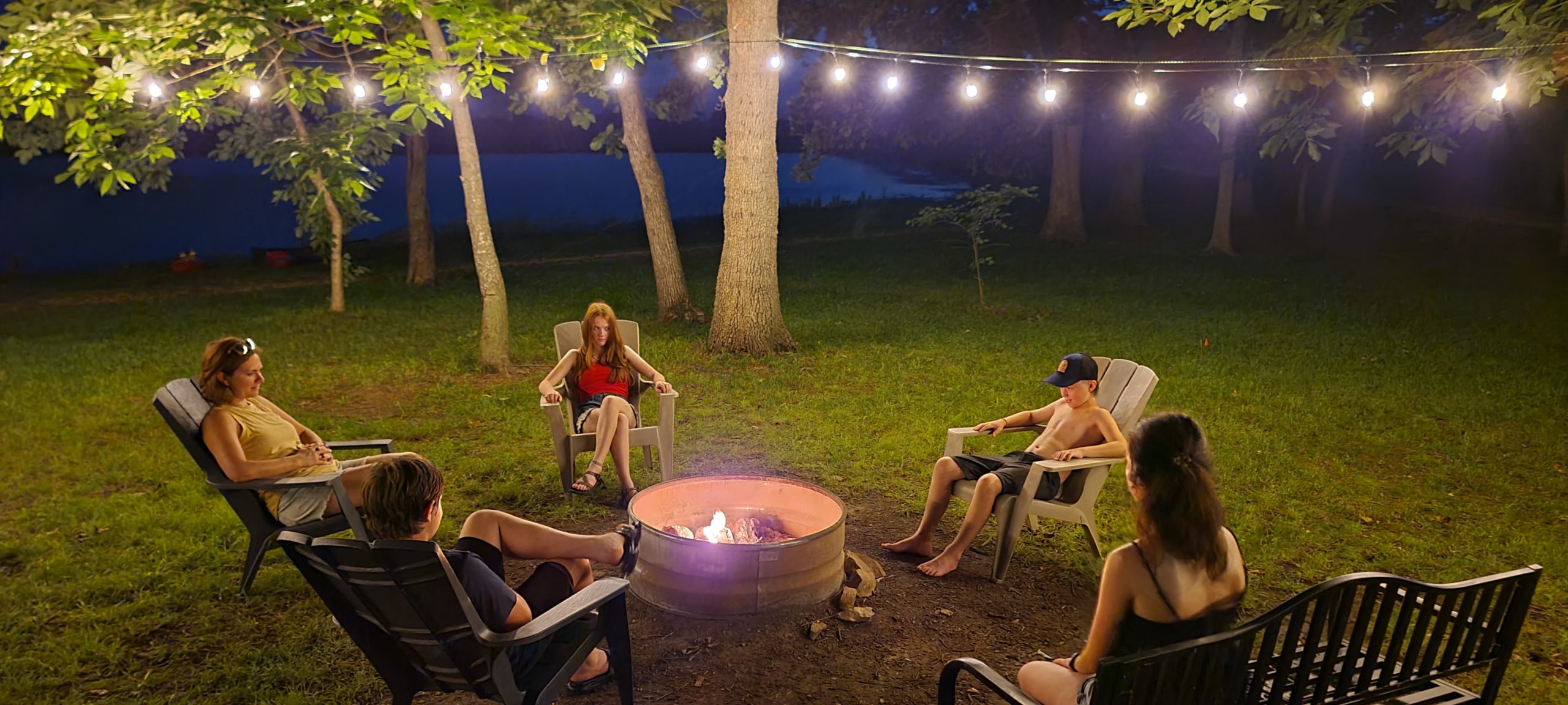 Family hanging out at Rock House Retreats campfire